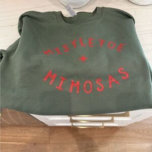 Green Sweatshirt with Red Lettering